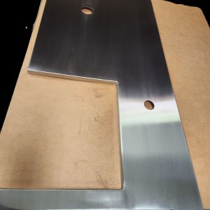 Stainless top for retail check out with bag well polished to a #4 finish.