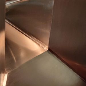 Inside of a stainless hopper #4 finish and strip polished.